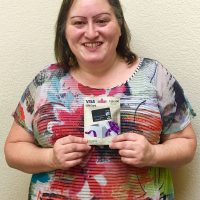 Woman holding gift card 12 Days of Christmas