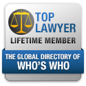A logo badge depicting scales of justice and text "Top Lawyer Lifetime Member, The Global Directory of Who's Who," potentially representing a Las Vegas personal injury law firm's prestigious recognition.