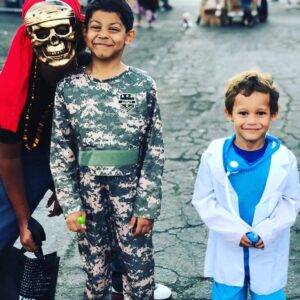 A photo of children in Halloween costumes – an army soldier, a doctor, and a pirate – subtly hints at unforeseen accidents during festive events, implying a personal injury law firm's readiness to assist in such unfortunate circumstances in Las Vegas.