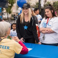 Volunteer table make-a-wish walk for wishes