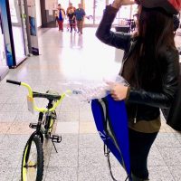 Girl with bike and helmet 2019 day of kings