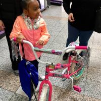 young girl and bike 2019 Day of Kings
