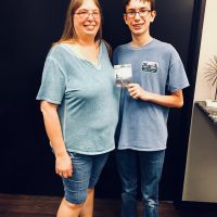Woman and young man Christmas in July