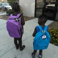 Back to school kids and backpacks