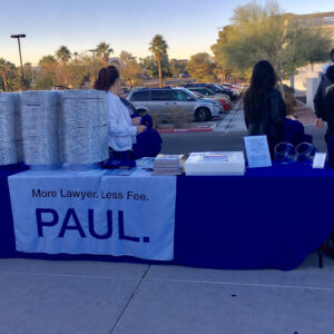 Promotional image of Paul's Law Firm in Las Vegas handing out pies, emphasizing "More Lawyer. Less Fee," to attract potential clients for personal injury cases.