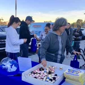 A Las Vegas law firm sponsors a community event with cupcakes and giveaways, supporting personal injury awareness and safety in the community.