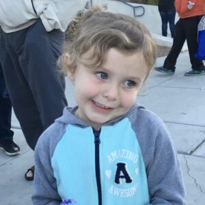 Image of a young girl smiling, suitable for representing the impact of personal injury cases on children and families in Las Vegas, emphasizing the law firm's commitment to protecting loved ones.