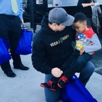 Paul Powell and child Thanksgiving turkey giveaway