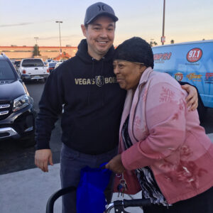 Las Vegas attorney embraces a client who appears to have mobility challenges, representing their commitment to personal injury cases and client care in Las Vegas.