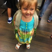 Young girl with backpack
