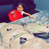 Young girl and backpack back to school