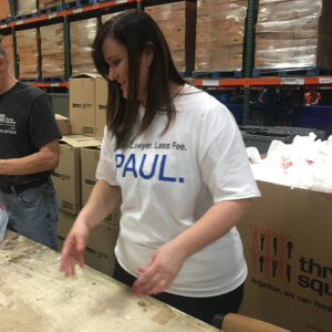 A Las Vegas personal injury attorney volunteers at a food bank, showing community support and dedication to helping those in need.
