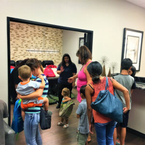 Image shows a family waiting in a Las Vegas law firm office, potentially seeking assistance with a personal injury claim, emphasizing the firm's focus on helping families in need.