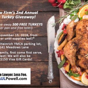 A Thanksgiving turkey on a platter with oranges, herbs, and a carving knife, advertising a free turkey giveaway for families in Las Vegas by a personal injury law firm.