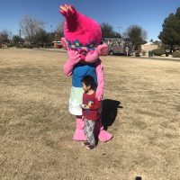 Child with volunteer community picnic