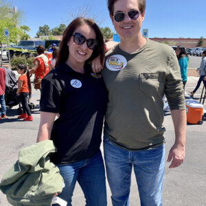 Las Vegas Personal Injury Attorneys pose for a photo at an outdoor community event with the 98.5 KKLZ radio station, highlighting their community involvement and legal services for personal injury cases.