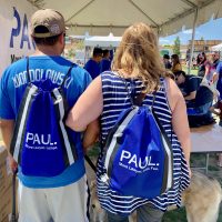 Couple with Paul Powell merchandise