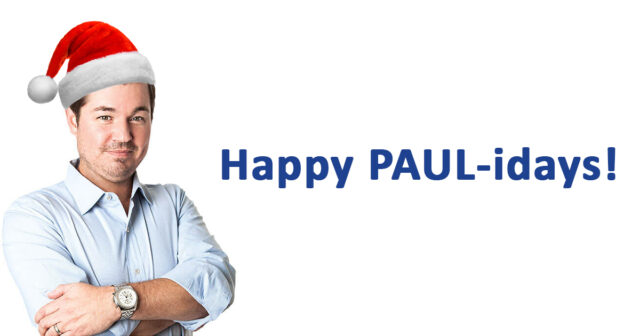 A man wearing a Santa hat and a watch is shown from the waist up, wishing the audience a "Happy PAUL-idays!" from his Las Vegas personal injury law firm.