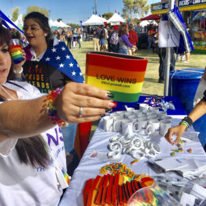 Law firm promoting their firm at the Pride event, supporting LGBTQ rights and offering resources for legal assistance in Las Vegas.