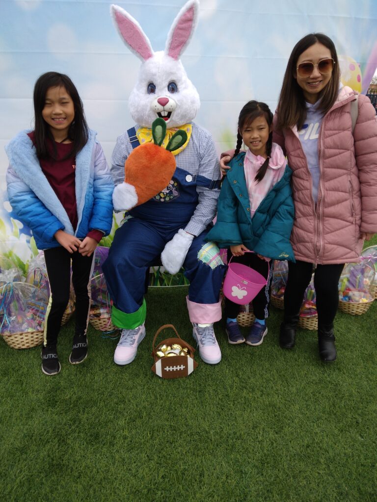 Family at local Easter event in Las Vegas, with the Easter Bunny, promoting community support and injury prevention awareness.